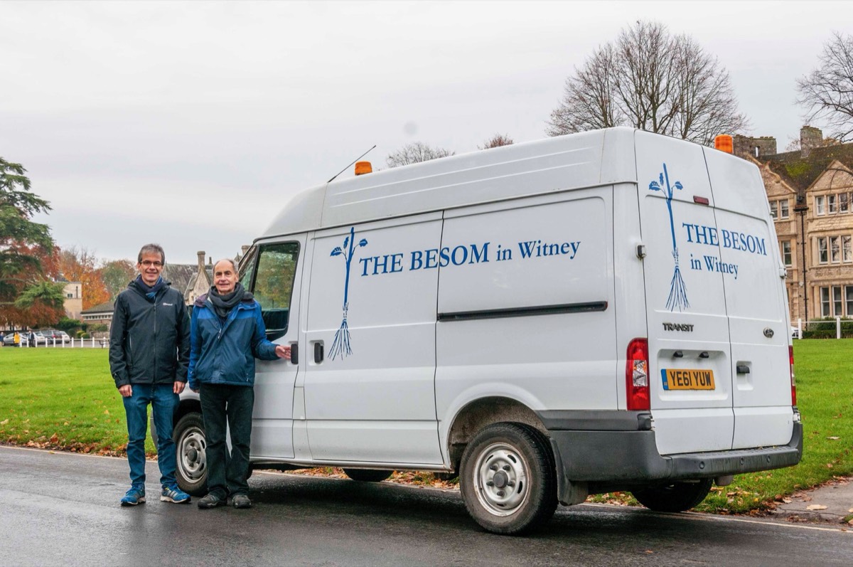 Two volunteers standing beside the Besom in Witney van